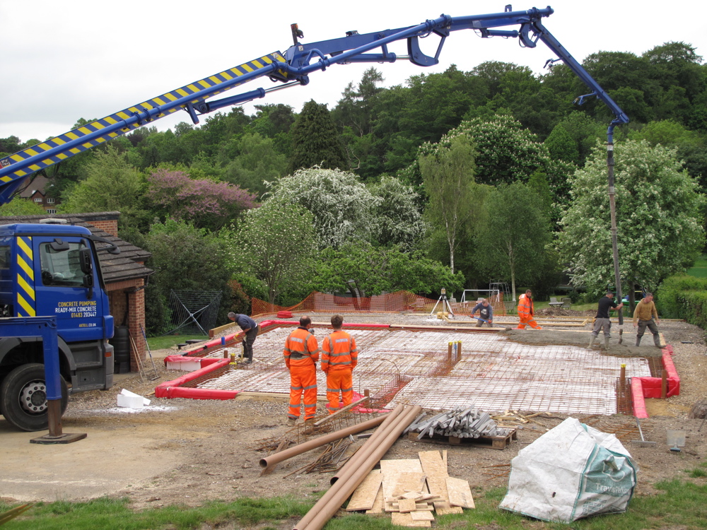 Adjusting the boom to reach the back of the slab