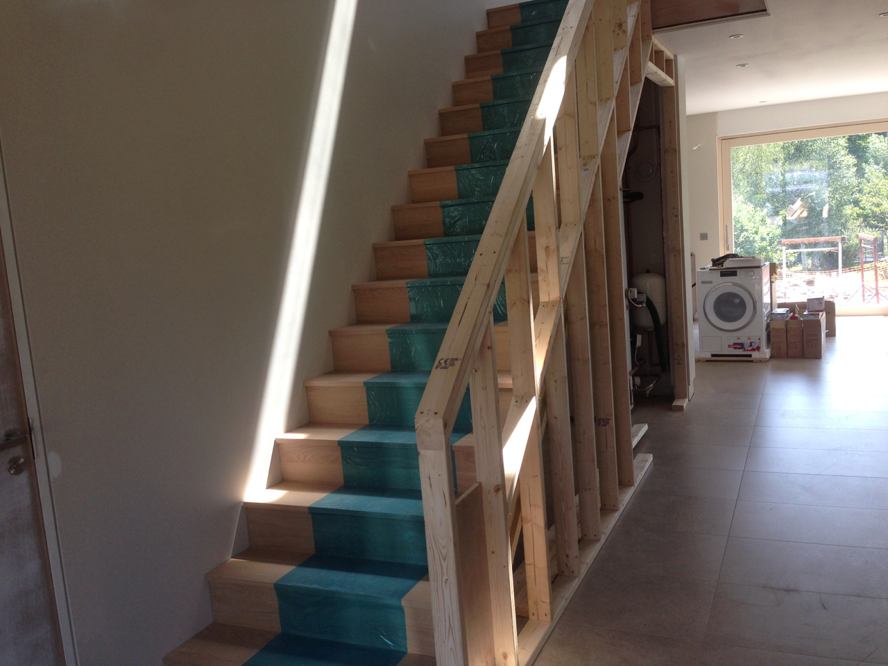 Timber framing for hand rail and storage under the stair.