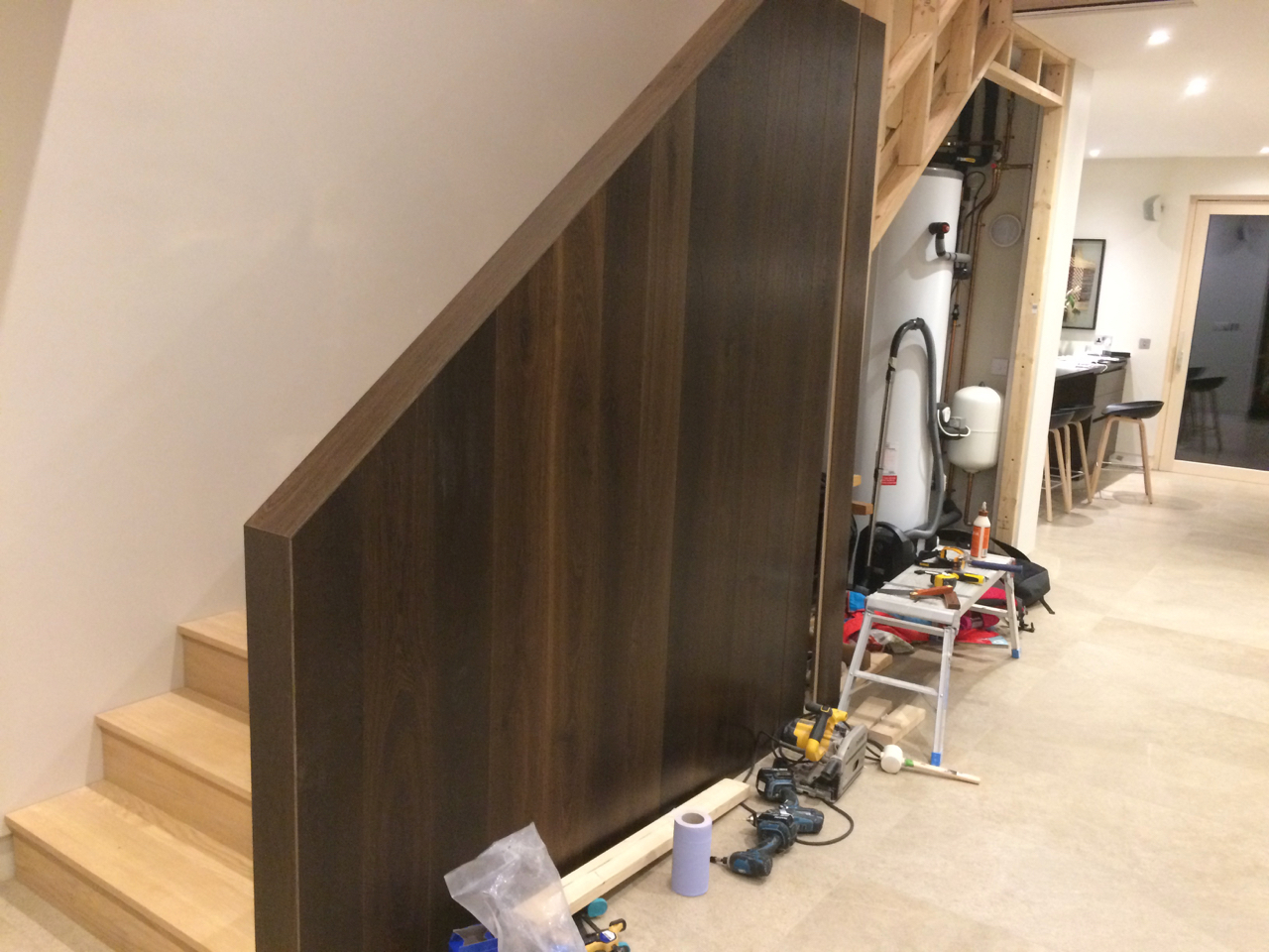 Fumed oak floorboards used to clad the handrail.