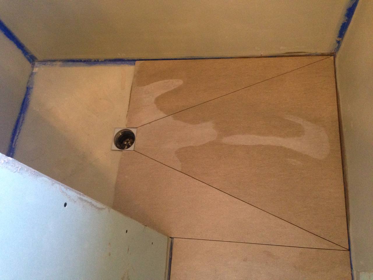 Cutting tiles for wet room floor