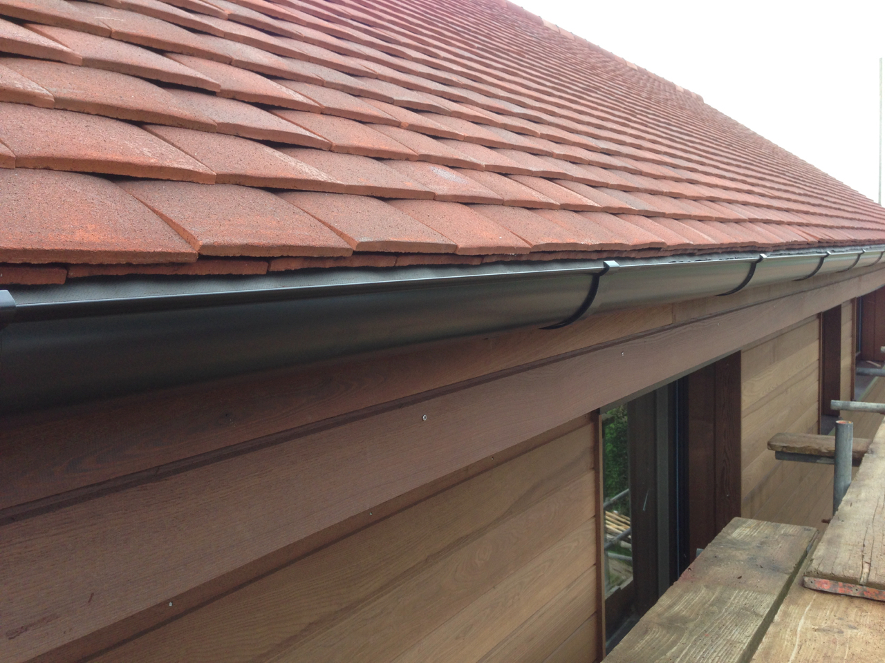 Guttering fixed to fascia